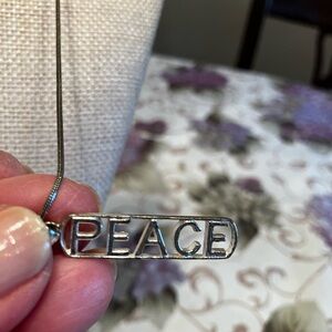 STERLING SILVER CHAIN AND PENDANT STAMPED PEACE